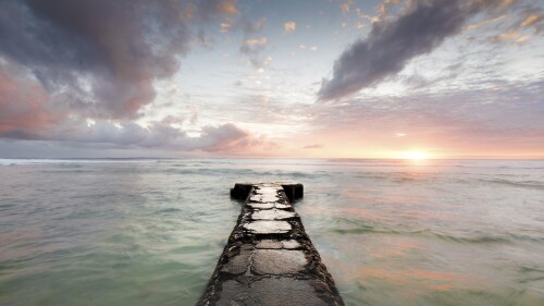 Cement-pier-extending-towards-the-horizon-on-a-cloudy-sunset-Big-Island-Hawaii.jpg