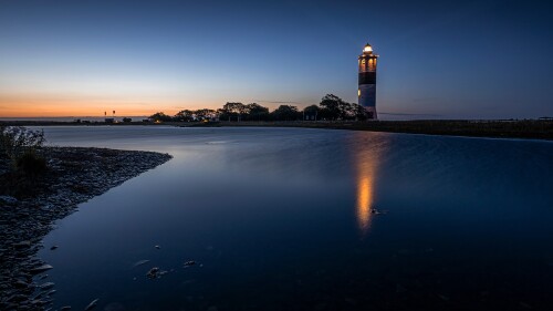 Illuminated-Lange-Jan-lighthouse-at-dusk-south-cape-of-Oland-island-Sweden.jpg