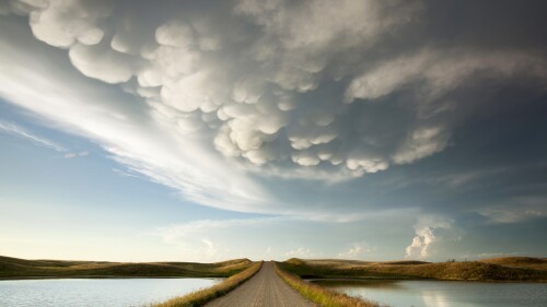 Mammatus-storm-clouds-over-a-prairie-dirt-road-Saskatchewan-Canada.jpg