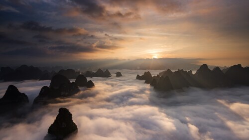 Sunrise-over-the-clouds-with-karst-formation-mountains-in-Guilin-Yangshuo-China.jpg