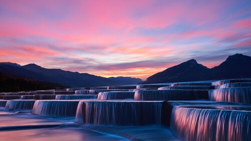 View-of-stepped-waterfall-group-at-sunrise-in-pink-sky-China.jpg