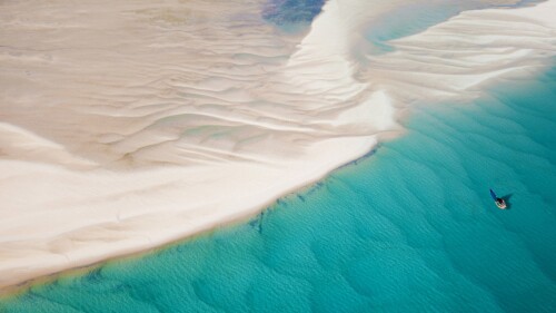 View-of-traditional-boat-sailing-among-sand-drifts-Bazaruto-Archipelago-Mozambique.jpg